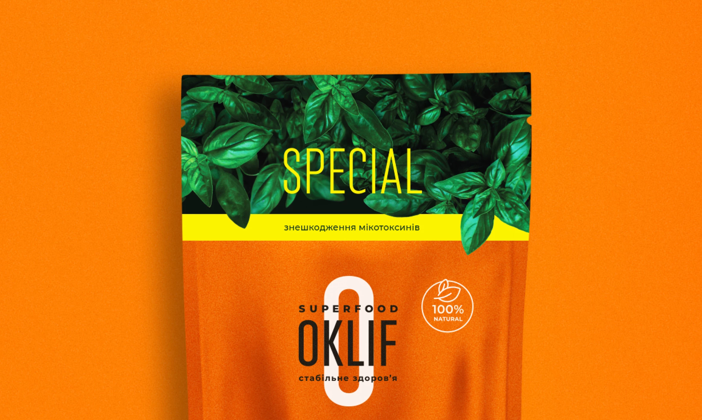 OKLIF Special superfood pouch design with basil leaves on an orange background