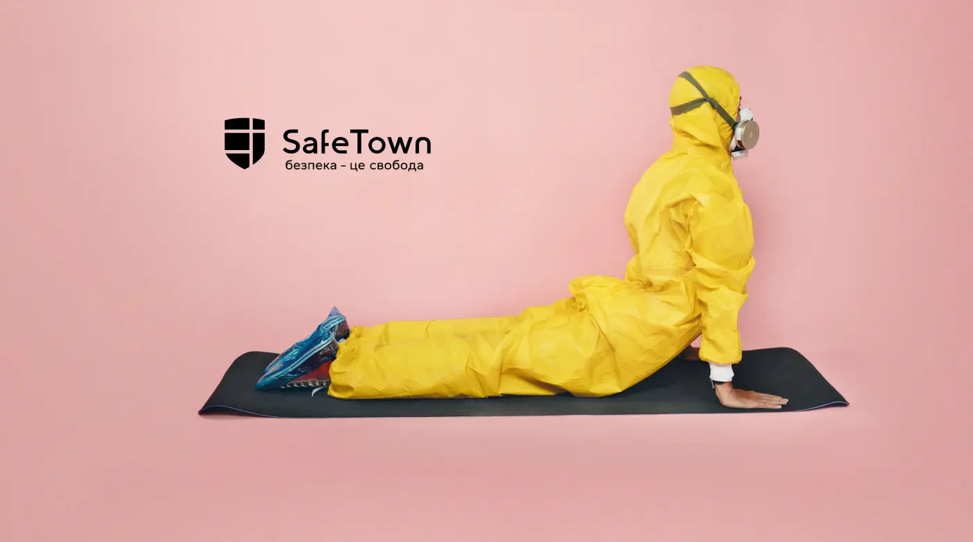 Safe Town branding with a person in a yellow hazmat suit doing a yoga pose