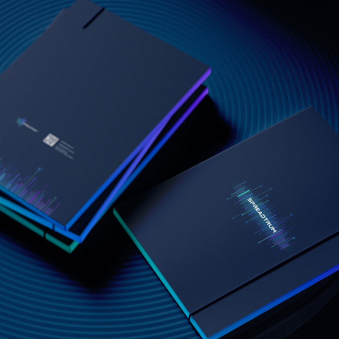 Spreadtrum branded notebooks with the logo on a dark blue background