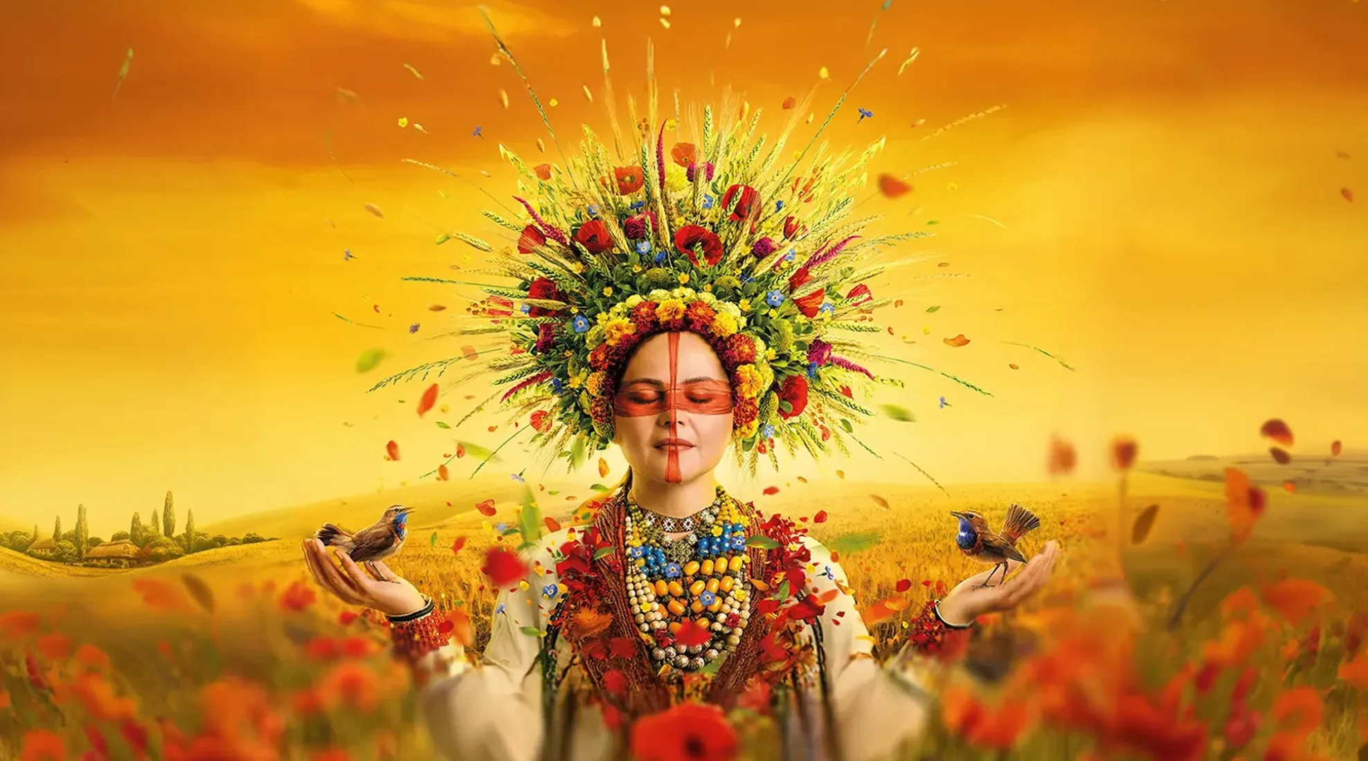 Woman in a Ukrainian floral wreath holding birds in a field of poppies